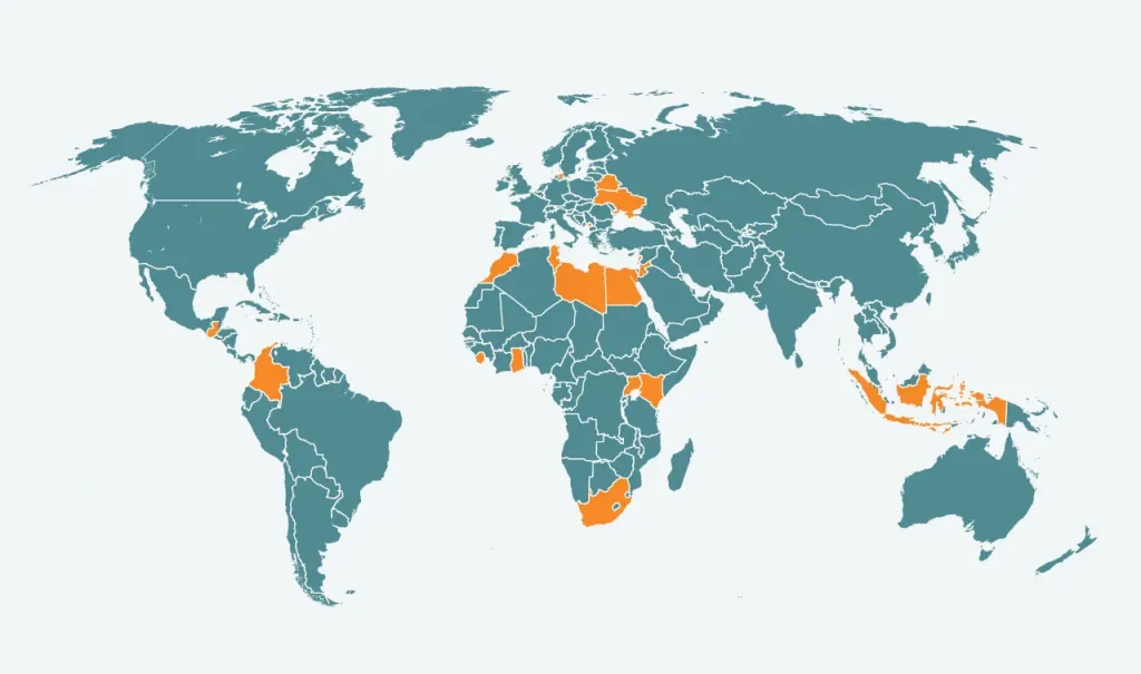 Tegnet verdenskort i blå med markederede orange områder, hvor DIGNITY arbejder